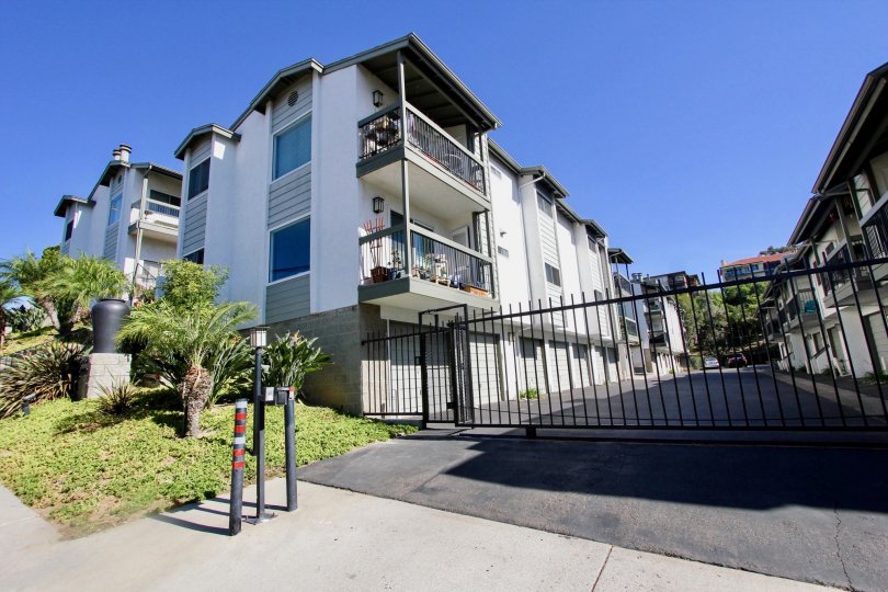 A front view of a gated apartment complex in Mission Hills, California.