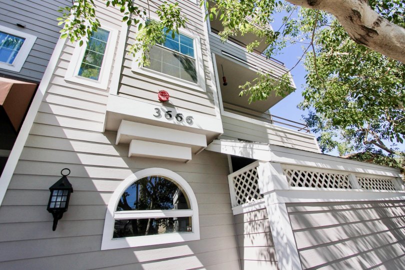 Looking up at house 3666 in Windsor Place on a sunny day in California.
