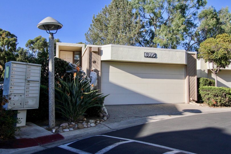 Street view of Friars Mission community with twin garage