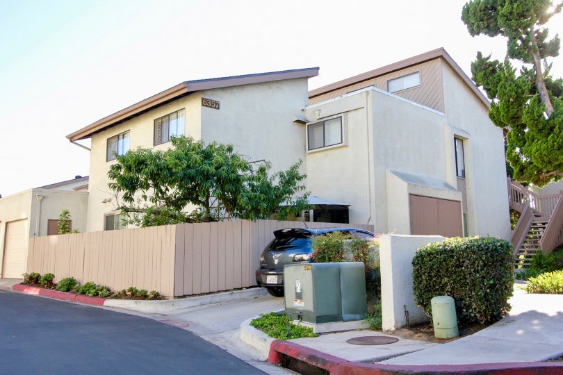Secluded corner lot with lots of windows and greenery at Friars Mission in Mission Valley, California.