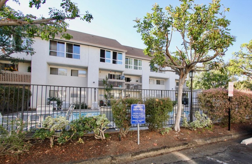 Mission Heights , Mission Valley ,California.trees, black fence