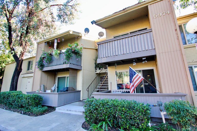 A Two story property in Rancho Mission Villas with private balconies and landscaping