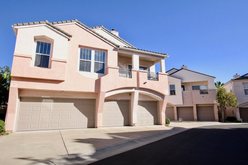 Two story pink town homes with three garages inside Union Square at Mission valley CA