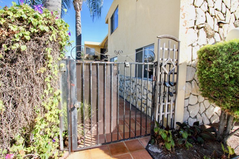The closed gate of the side entrance for the house on 33rd Street Manor.