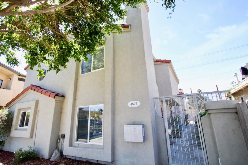 Railing entrance door with sliding windows and tiles in 4572 Kansas St.