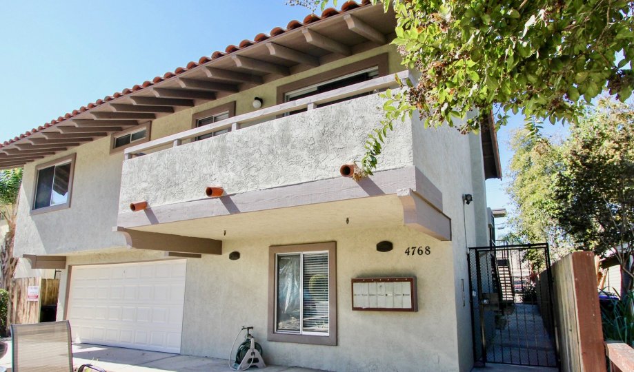 A two-storey residence with an exposed eave and balcony in 4768 35th St neighborhood.