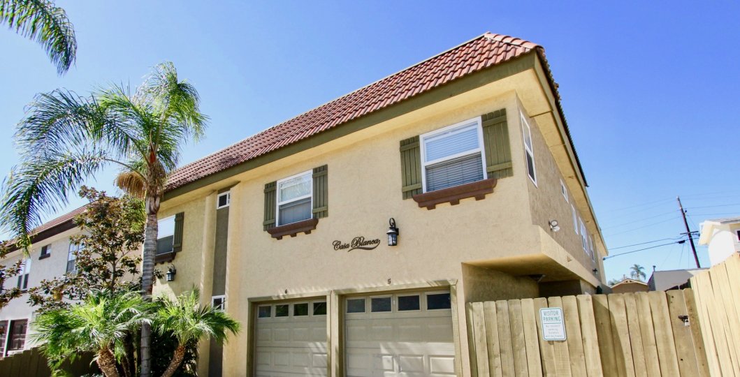 THE BUNGALOW IN THE CASA BLANCA VILLAS WITH THE SHUTTERS, WOOD WALL, TREES, WINDOW, POST WIRES