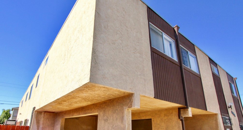 A two story cement and wood town home building in Normal Heights CA at Teralta Heights