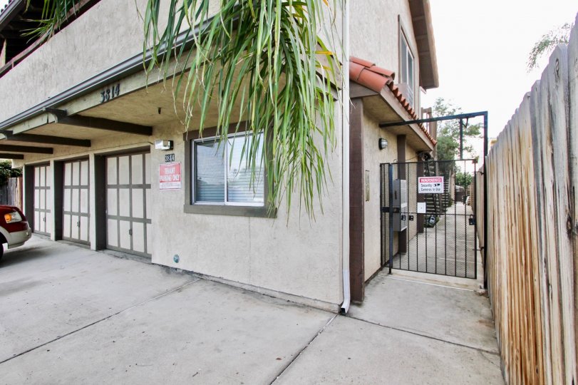 Community 3814 35th St. North Park California gate palm tree garage windows balcony tile roof fence