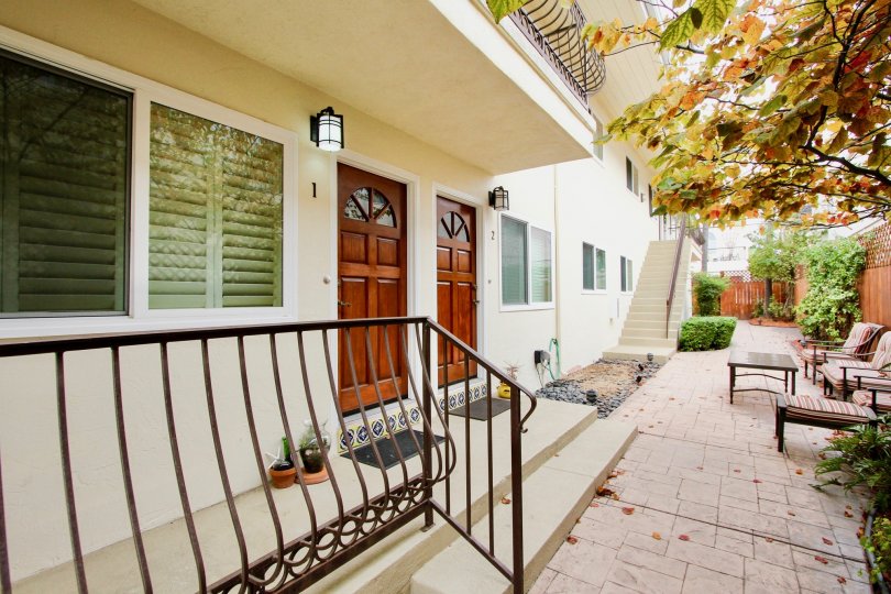 A view of the front entrance of the apartment homes at North Park Place including the paved terrace in the fall.
