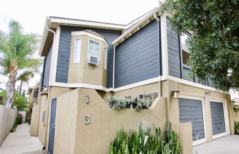 Victorian House VI community North Park California blue bay windows garage courtyard landscaping gate