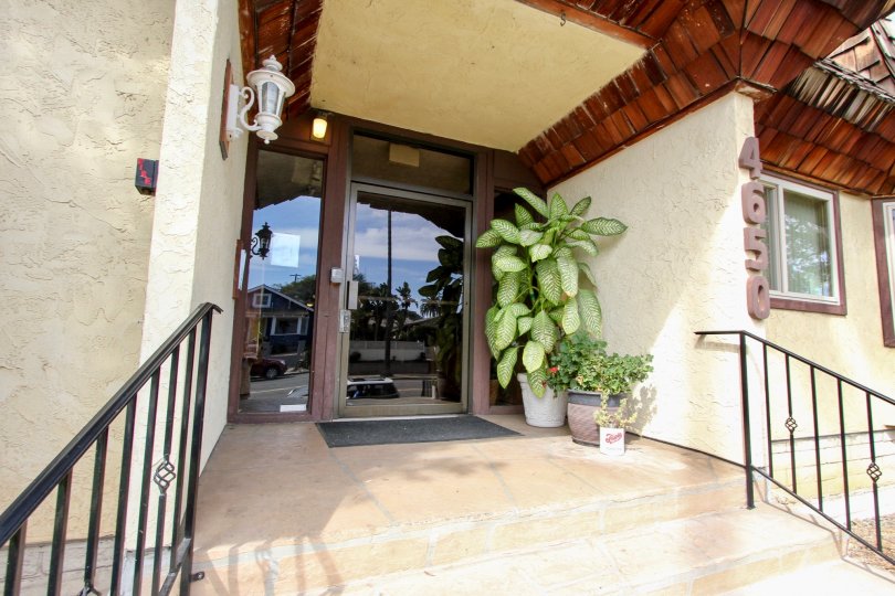 A glass door = an entrance of a building in Loma Pacific neighborhood