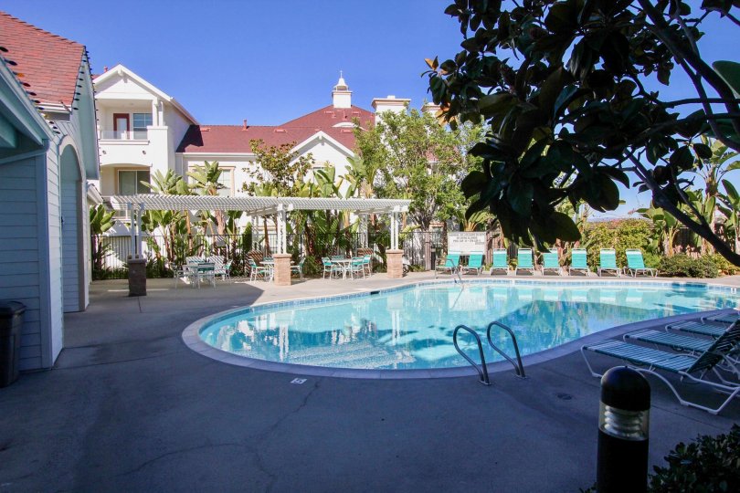 The sparkling pool and charming poolhouse at Harbor Cliff in Oceanside, California.