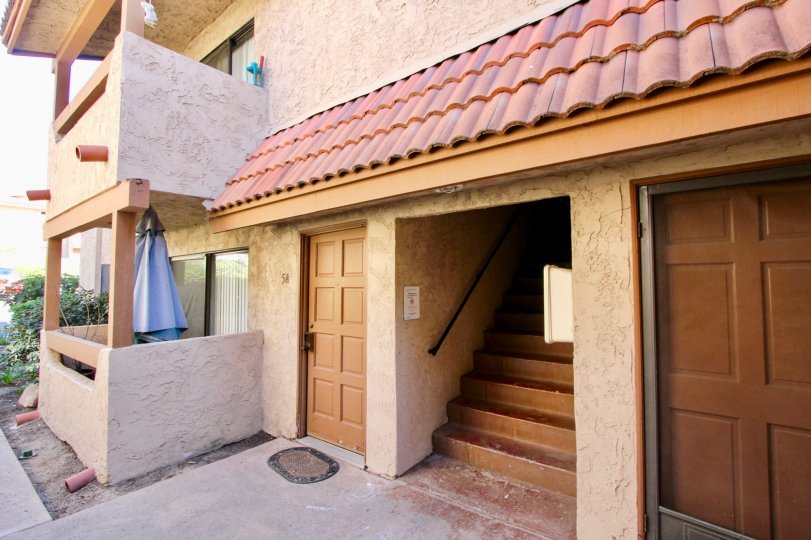 A view in front of a house with a balcony in Loma Alta Village, Oceanside