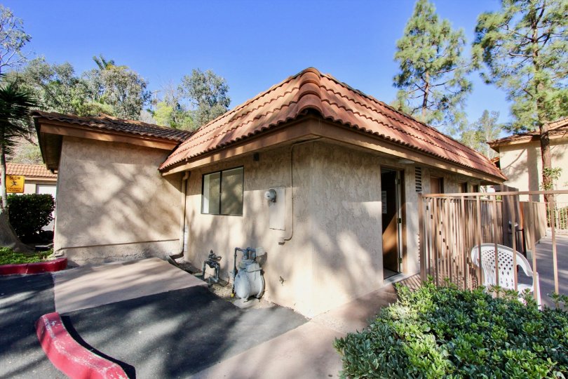 A simple house in Loma Alta Village community with tiled roof and beautiful yard