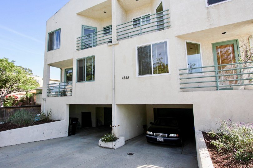A sunny day in TheChalcedony Townhomes with beautiful Grden and car parking porch