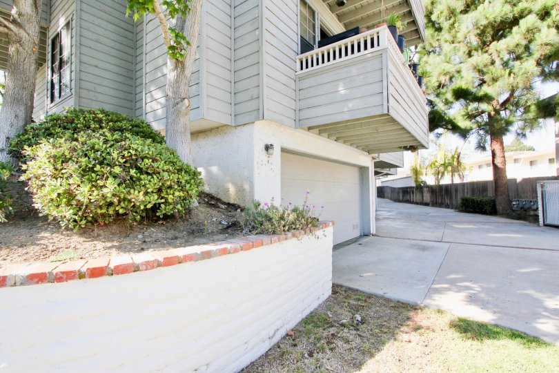 Excellent approach of house with trees and car parking in Diamond by the Bay of Pacific Beach area