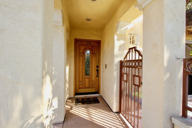 a sunny morning in the hornblend condos with a house that has its door inside the side gate