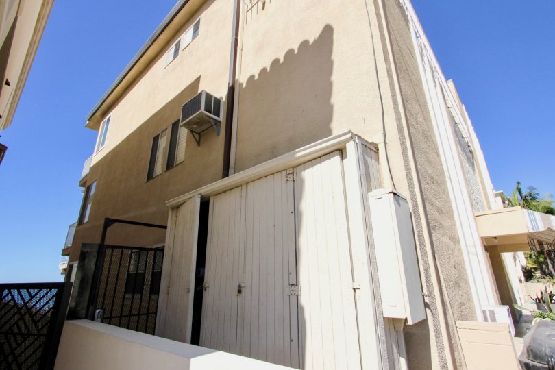 A CREAM COLOURED BUINDING FACILATED WITH AC IN RIVIERA TERRACE
