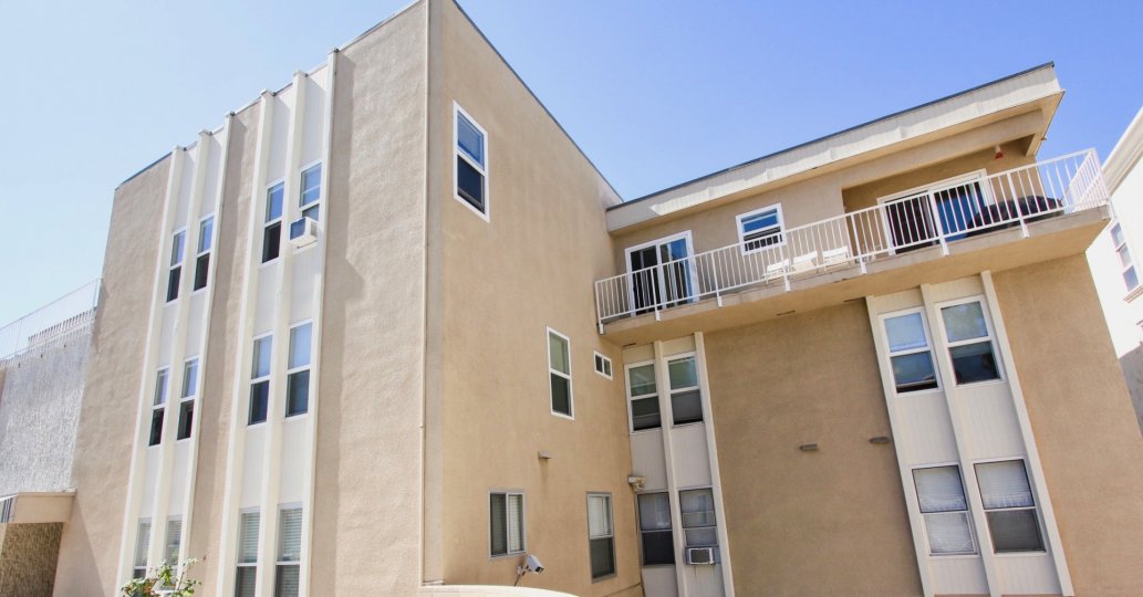 A beautiful three story condo with a balcony view with a attached car garage