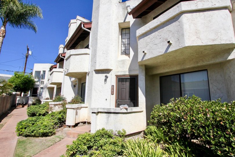 Front door and balcony of a unit at Thomas Townhomes in Pacific Beach, California