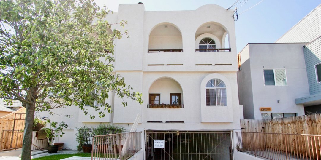 A bright exterior shot of Primrose Villas a gated looking community