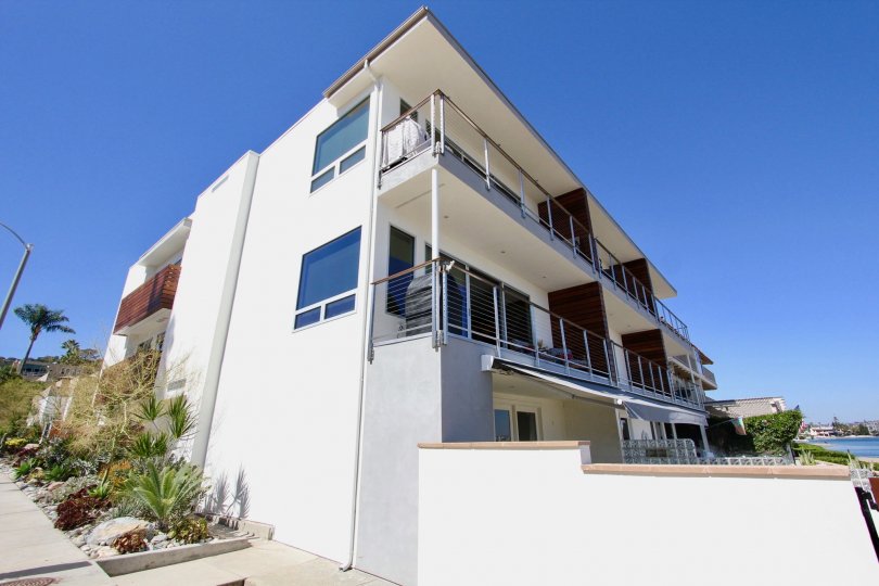 A three story condominium building located in Point Loma CA at Vista De Bahia