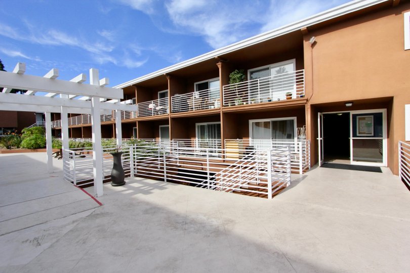 Private terrace for residents with wooden pergola and iron railings at the Yacht Club Condos