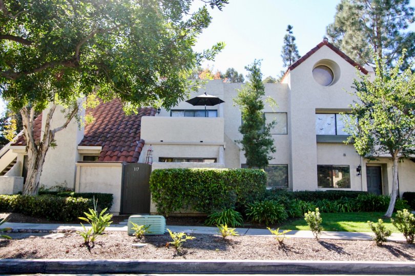Two story housing with plants at Bernardo Pines in Rancho Bernardo CA