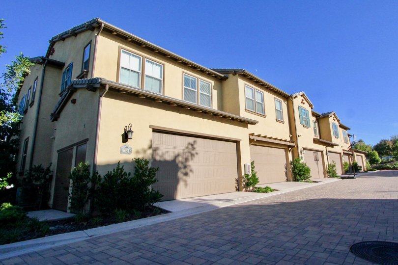 Housing with garages near a driveway at Mandolin in Rancho Bernardo CA