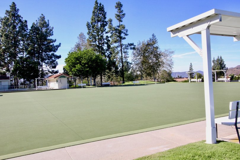 View of lawn at Oaks North Village Rancho Bernardo California with sitting bench