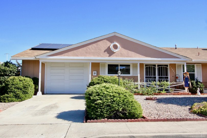 Single story home with white garage door at Seven Oaks in Rancho Bernardo CA