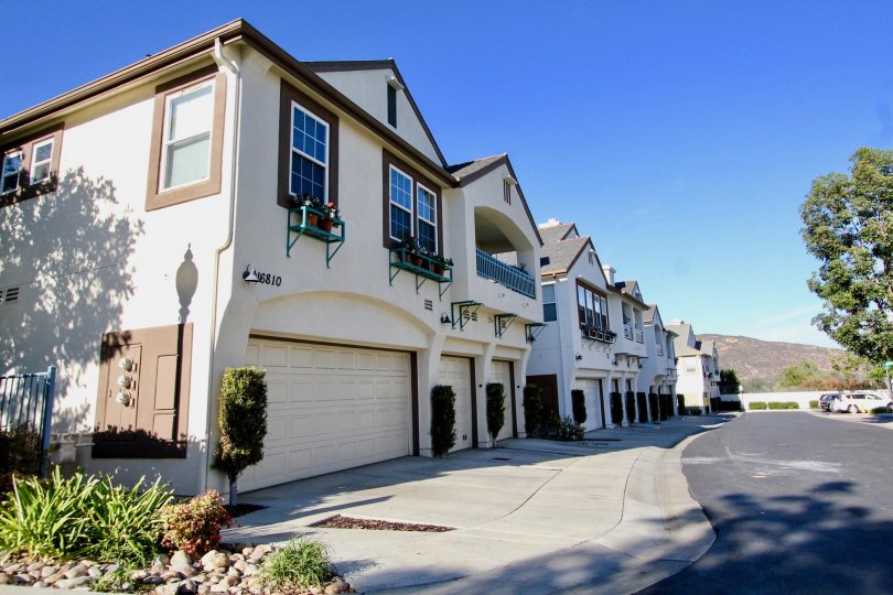 Brown and white housing near a driveway at Sitella in Rancho Bernardo California