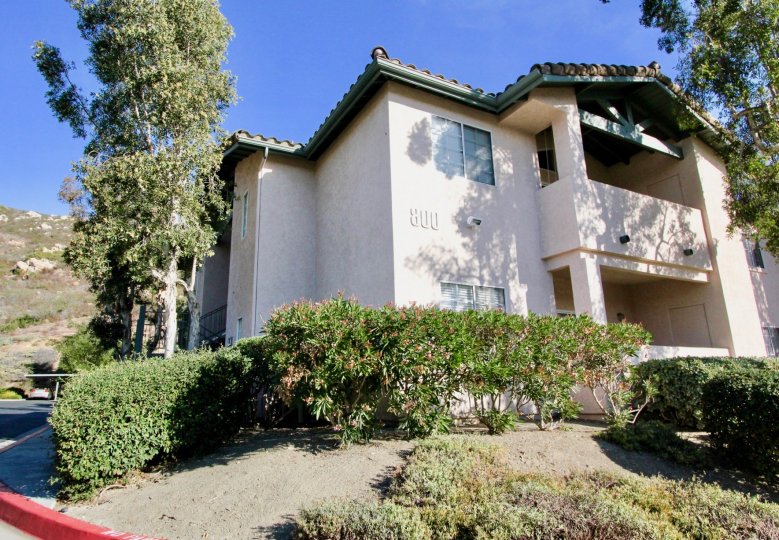 Two story condo buildings at the base of a hillside in The Summit Rancho Bernardo CA