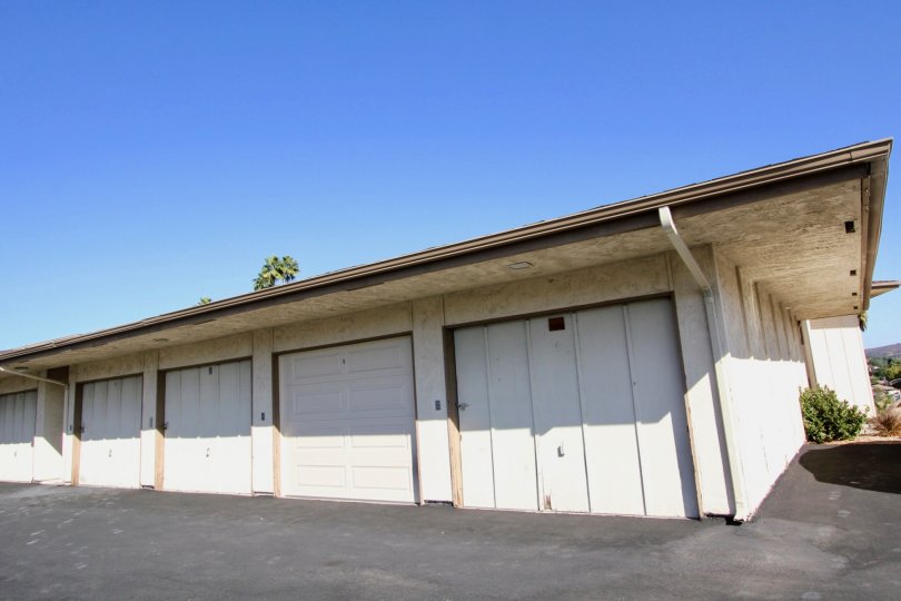 Run down garages on black pavement in Lake San Marcos III in San Marcos CA