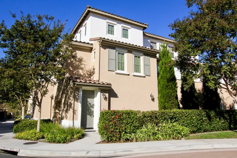 Pink home with fake shutters in Larkspur Heights at San Marcos CA