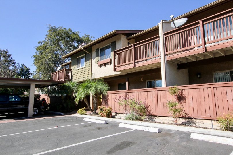 A two-storey apartment with reddish railings in the Westlake Ranch in San Marcos, CA.