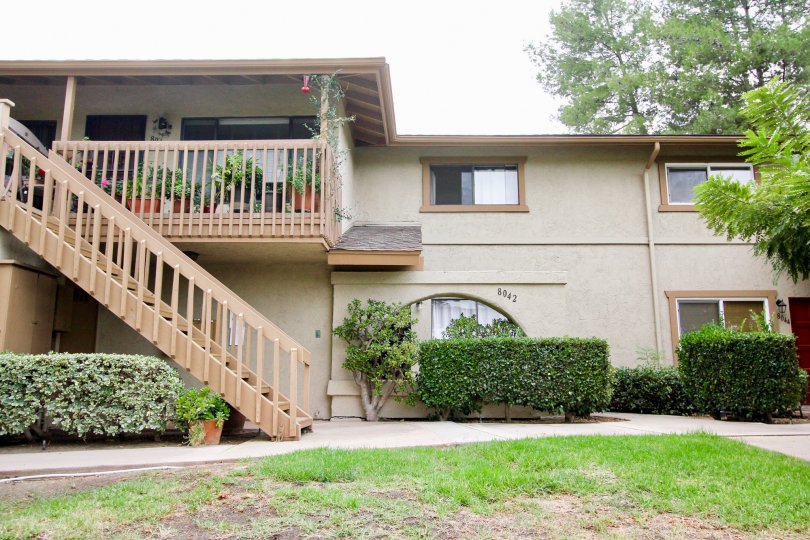 two story building with brown staircase that shows upper and lower floors of home