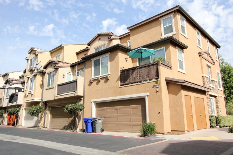 Row of houses with garages and balconies in Riverwalk, Santee, California