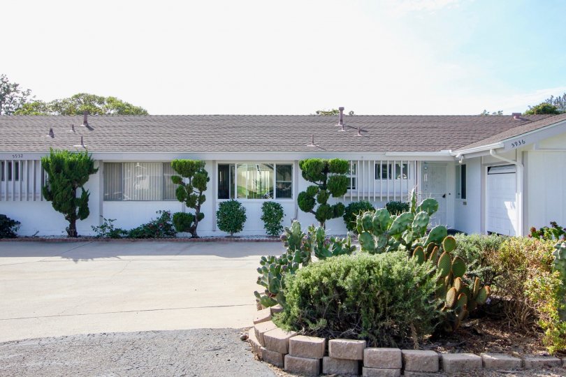 Singe story housing with parking and garden at Pennant Village in University City California.