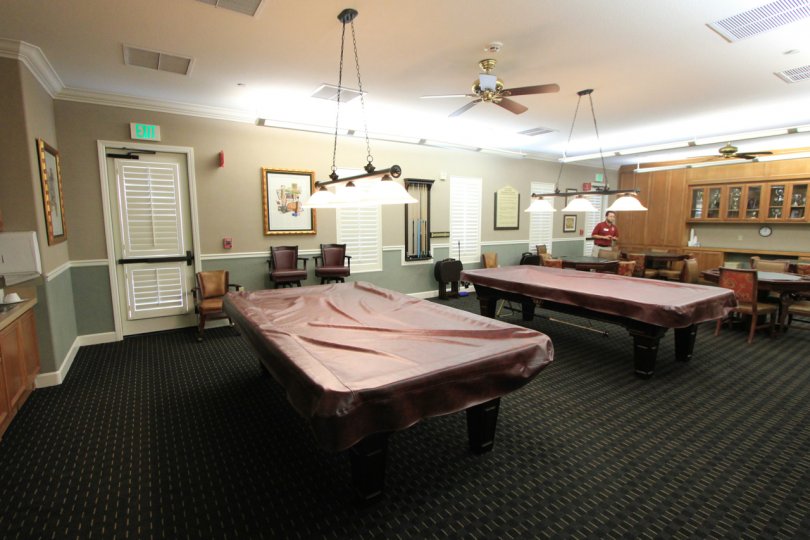 Two pool tables and several card tables in the Lodge at four seasons