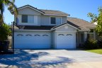 This beautiful two story home with three car garage and modest front yard resides in Mira Costa Community in Oceanside California